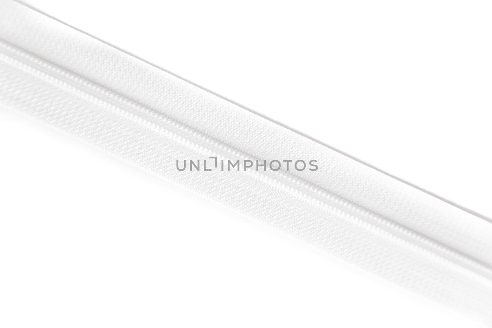 White zipper isolated on white background. Clothing fastener.
