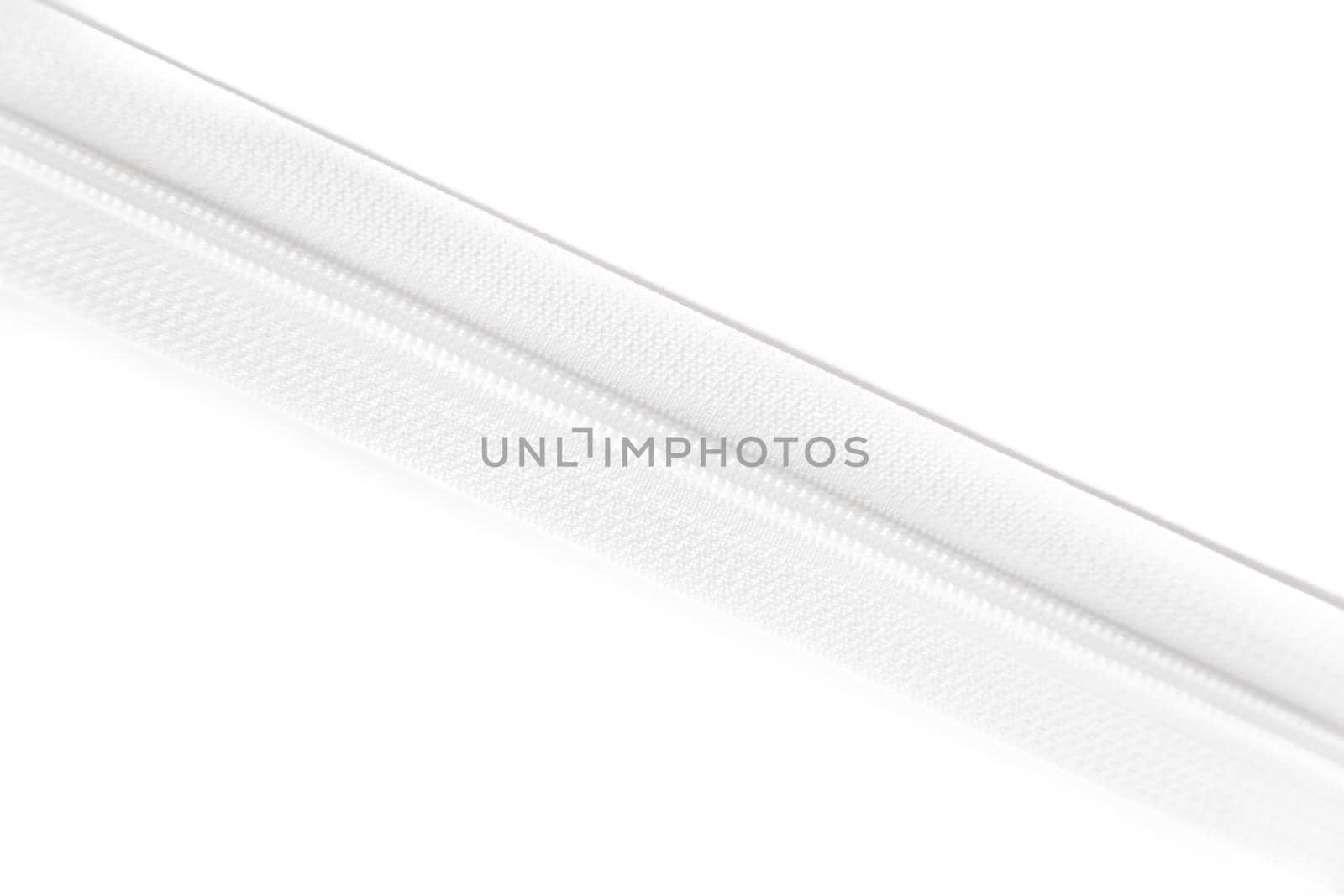 White zipper isolated on white background. Clothing fastener.