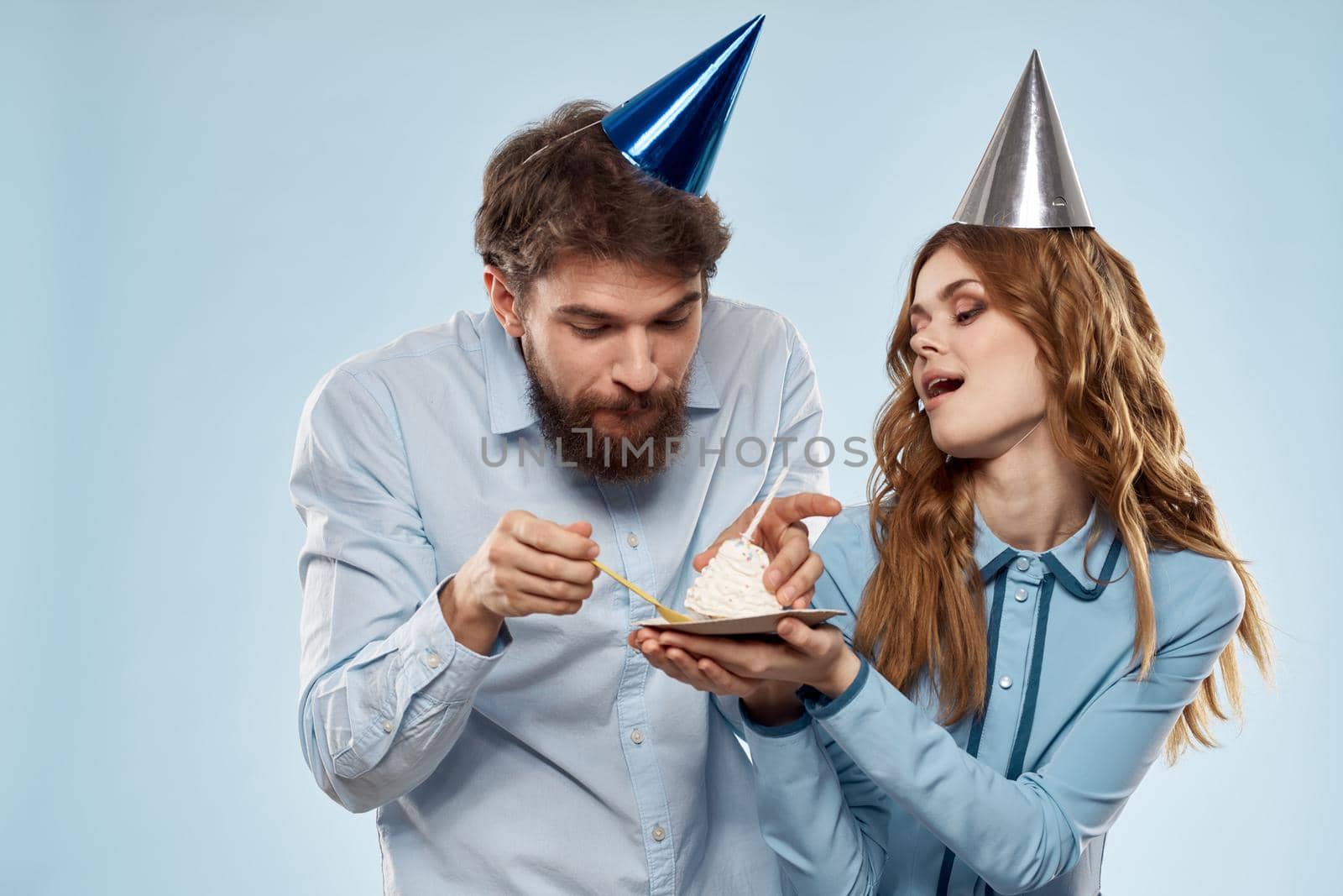 Birthday cake with candle man and woman corporate party fun holidays. High quality photo
