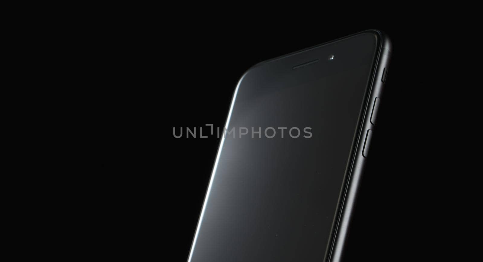 touchscreen mobile phone on black background new technologies without buttons. High quality photo
