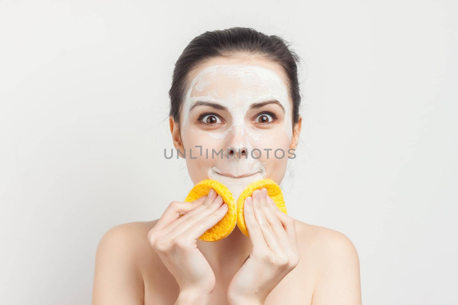 woman holding sponges in hands removing makeup. High quality photo