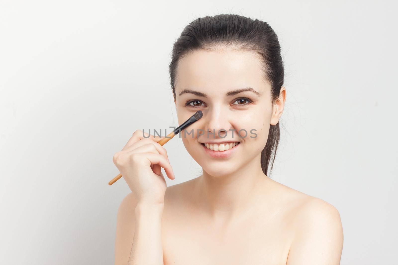 pretty woman naked shoulders face cream skin care cosmetology. High quality photo