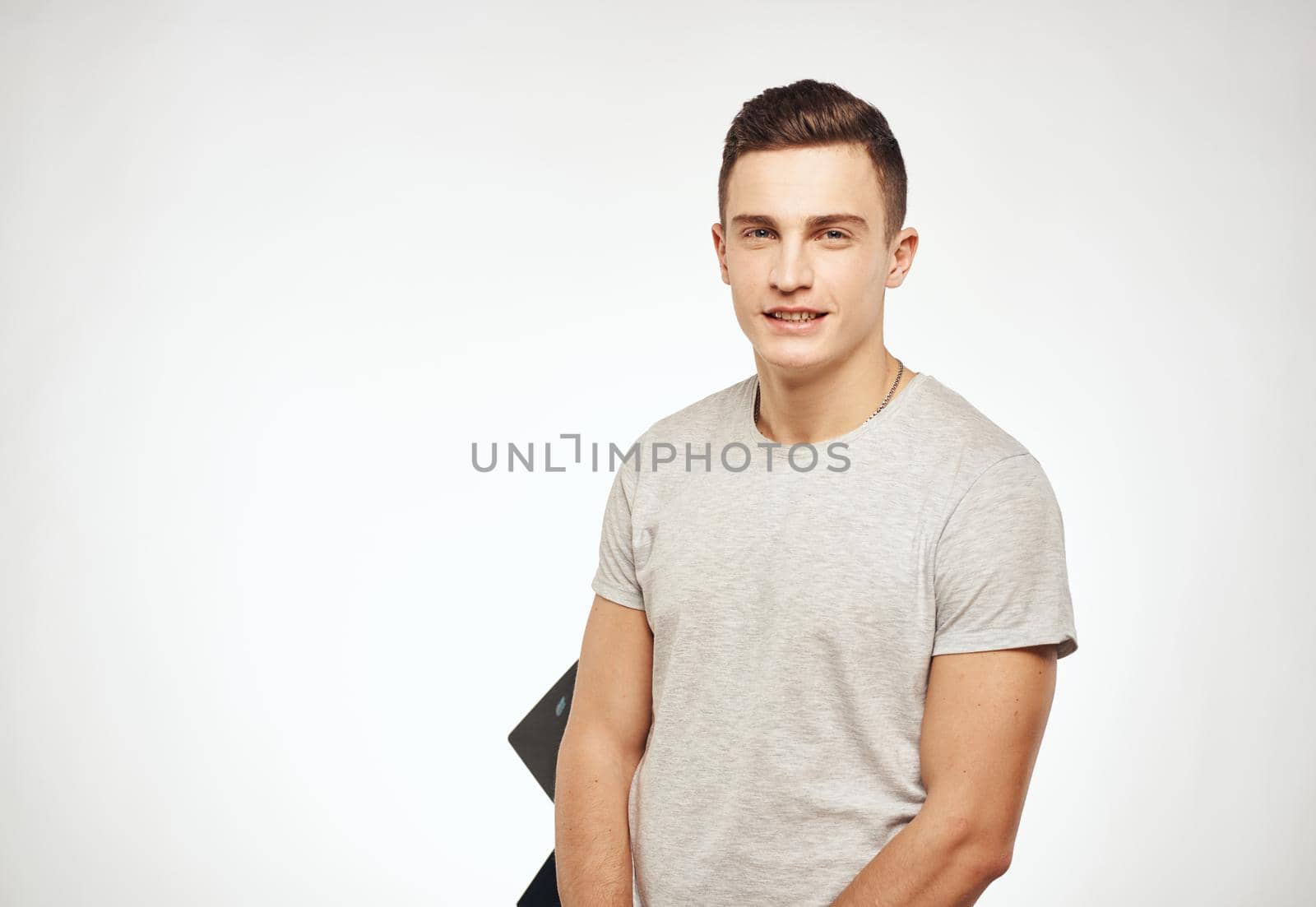 handsome man studio light background model close-up. High quality photo