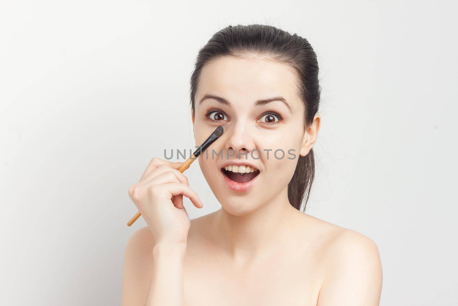 pretty woman naked shoulders face cream skin care cosmetology. High quality photo
