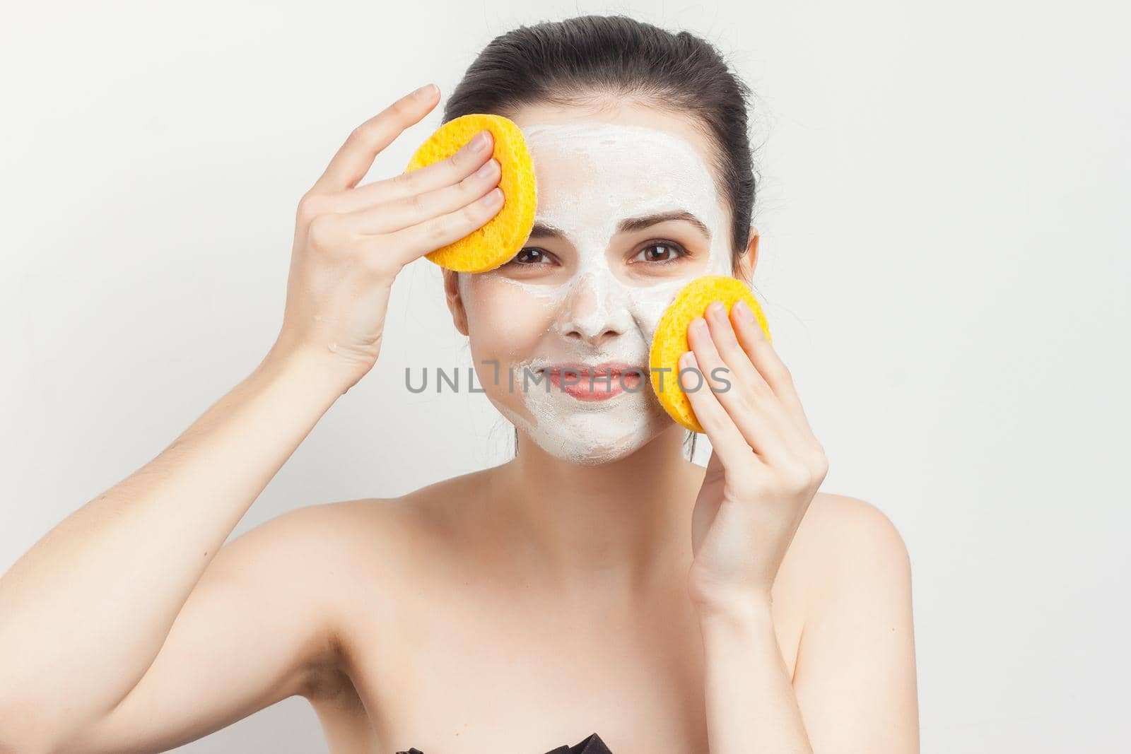 pretty woman with bare shoulders skin care makeup. High quality photo