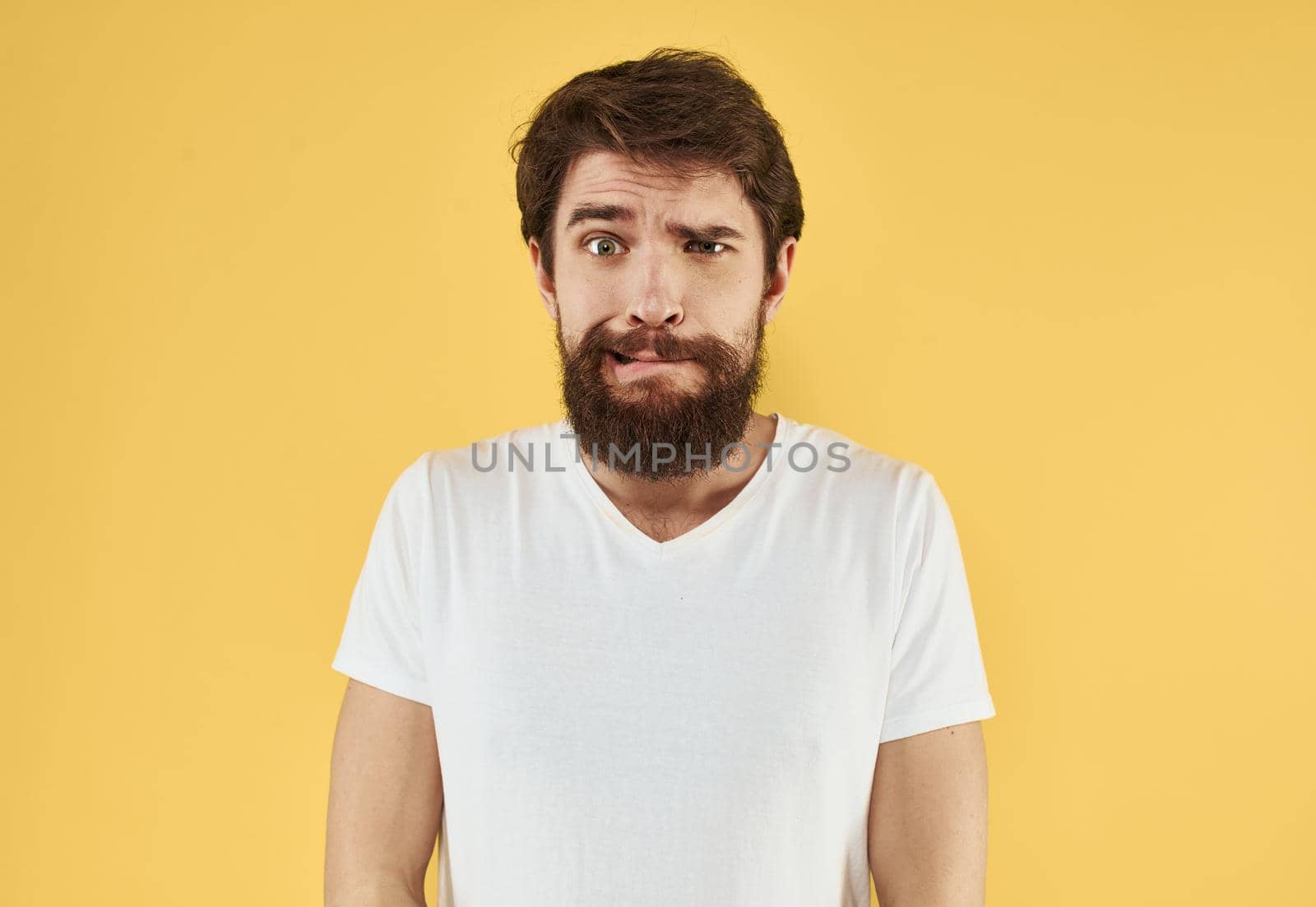 portrait of a man white t-shirt yellow background cropped view Copy Space by SHOTPRIME