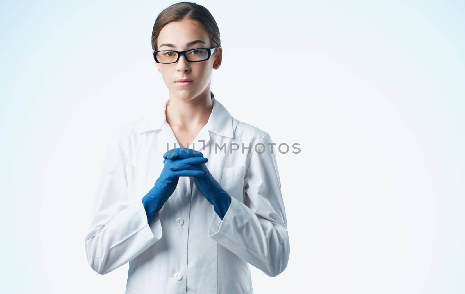 female doctor in a medical gown and blue gloves vaccination tests. High quality photo