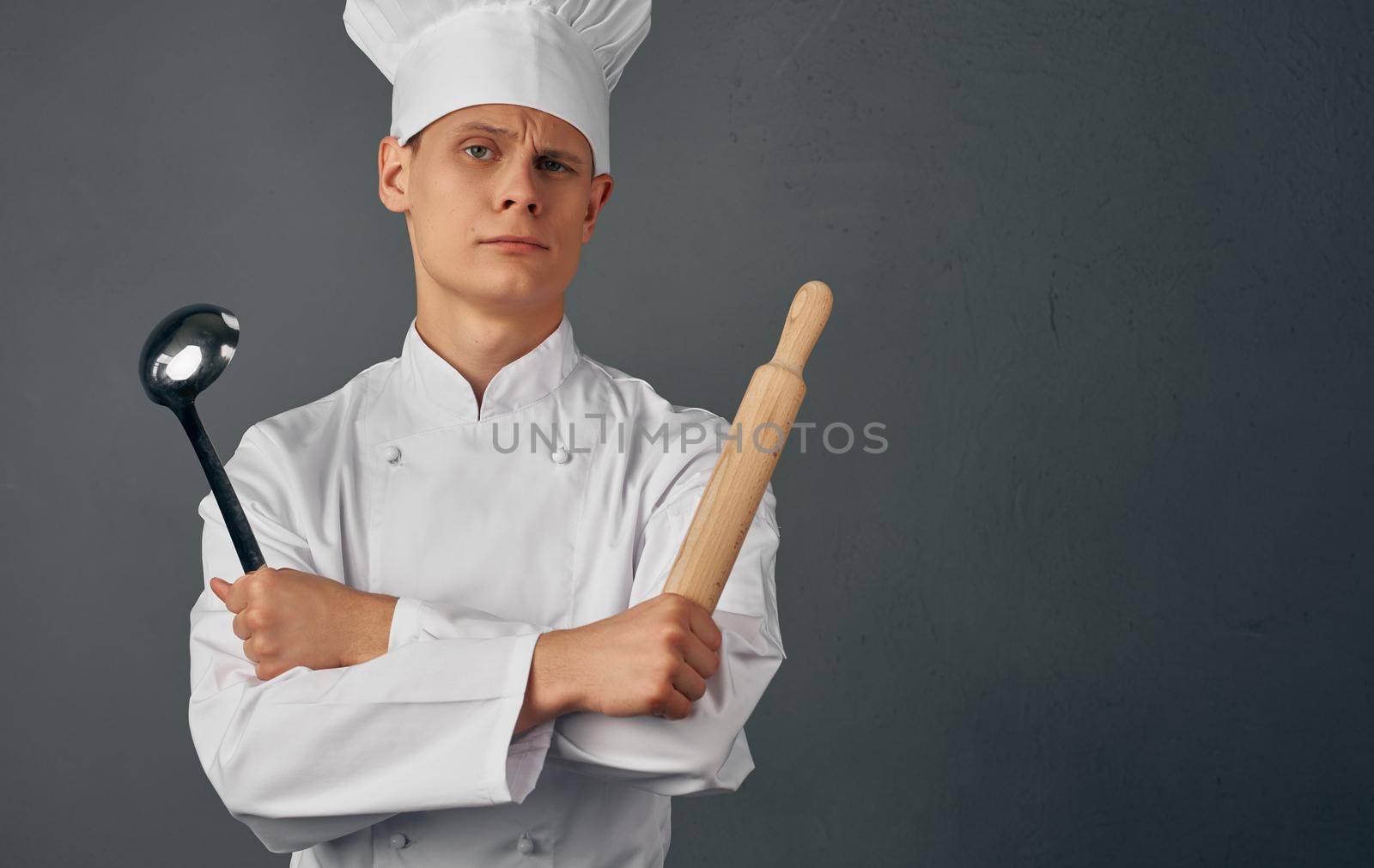 male chef kitchenware cooking in restaurant studio. High quality photo