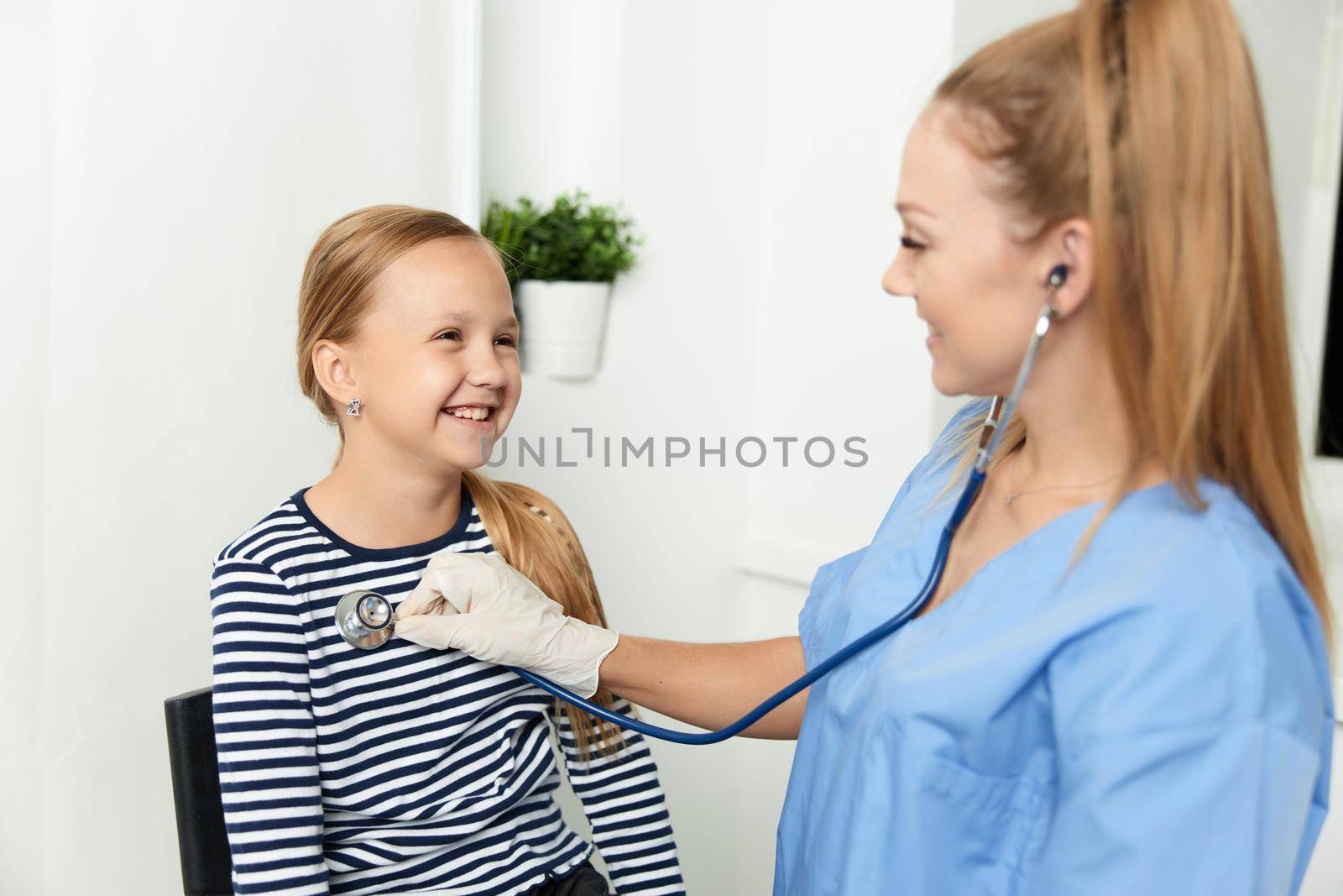 woman doctor examines a child in hospital treatment. High quality photo