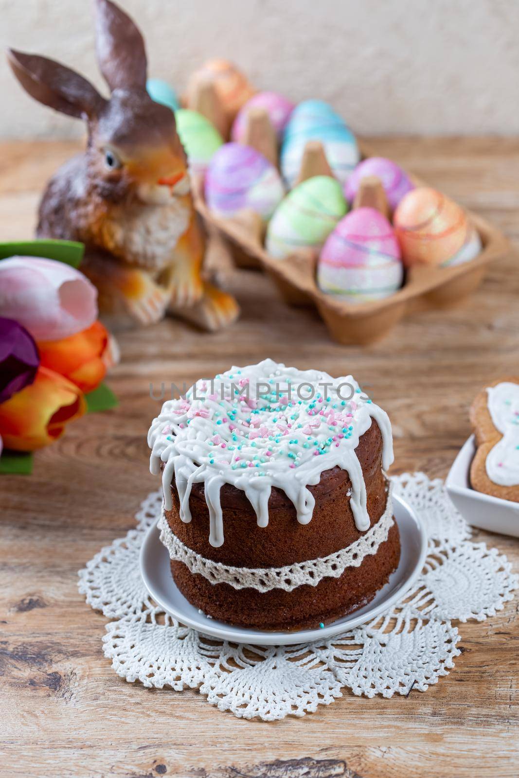 Easter still life with cake, homemade cookies, decorative figurine of rabbit by galinasharapova