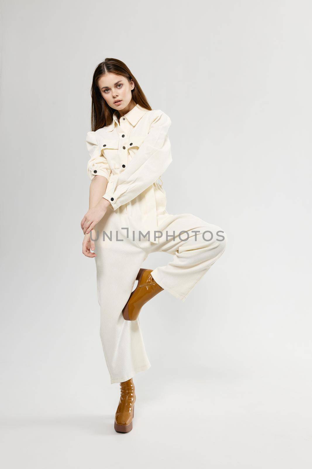 Woman in white jumpsuit fashion modern style charm by SHOTPRIME