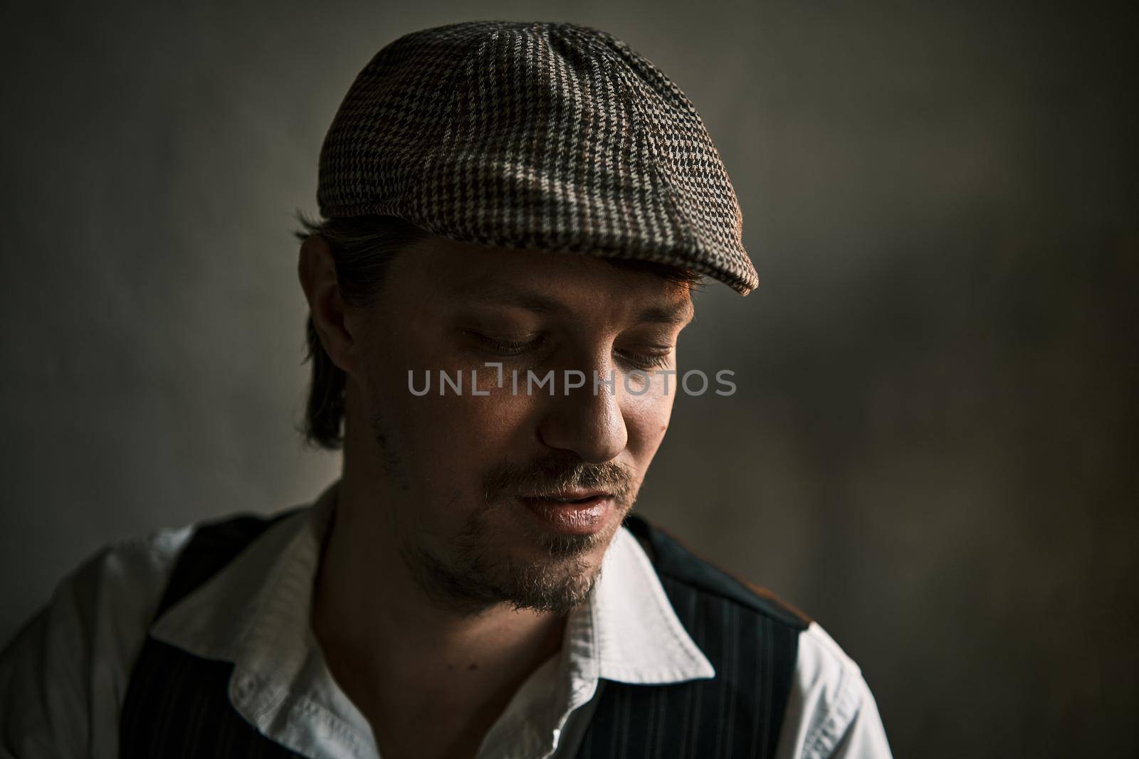 Young guy dressed in a retro style, in a beret, cinematic shot, big closeup