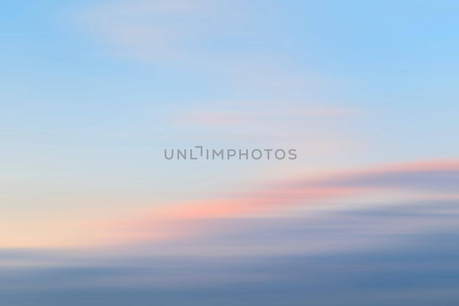 Abstract blurred nature background. Clouds in motion blur. Background for design and templates