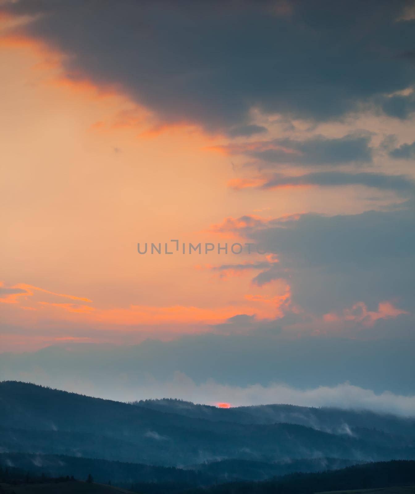 Beautiful sky with cloud during sunrise or sunset. Sunset clouds in the mountains. Abstract nature background.
