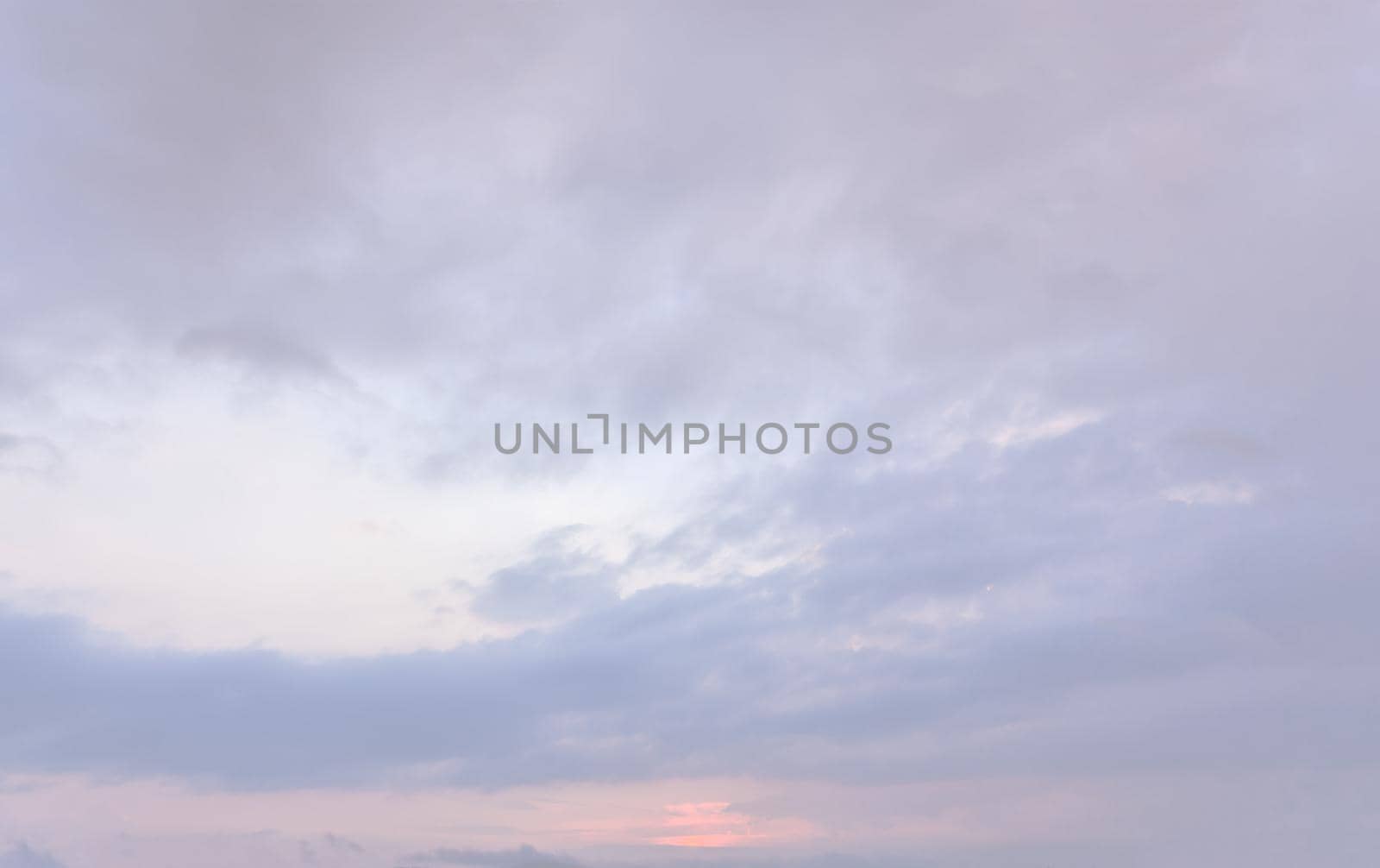 Beautiful sky with cloud during sunrise or sunset. Sunset clouds in the mountains. Abstract nature background. Image in light tonality