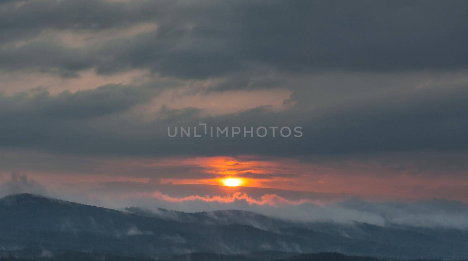 Beautiful sky with cloud during sunrise or sunset. Sunset clouds in the mountains. Abstract nature background.