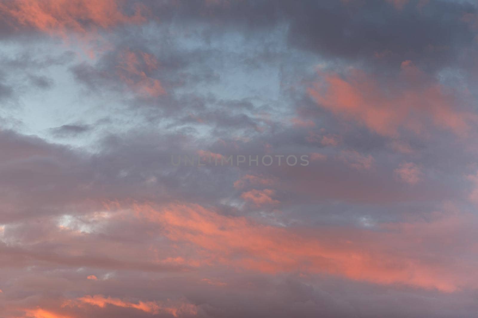 Abstract nature background. Colorful dramatic sky with cloud at sunset. Dramatic and moody pink, purple and blue cloudy sunset sky 
