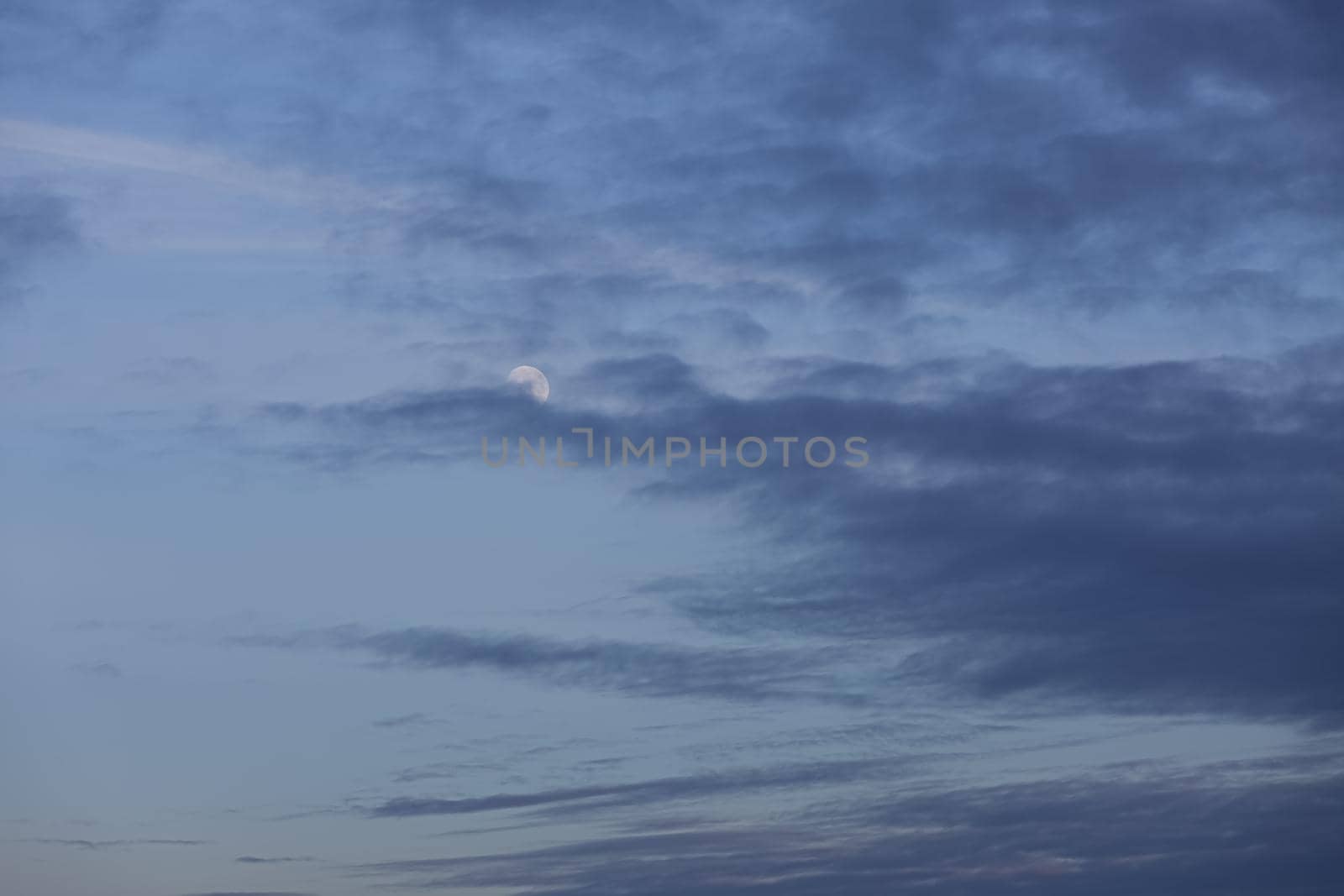 Evening sky with clouds and moon