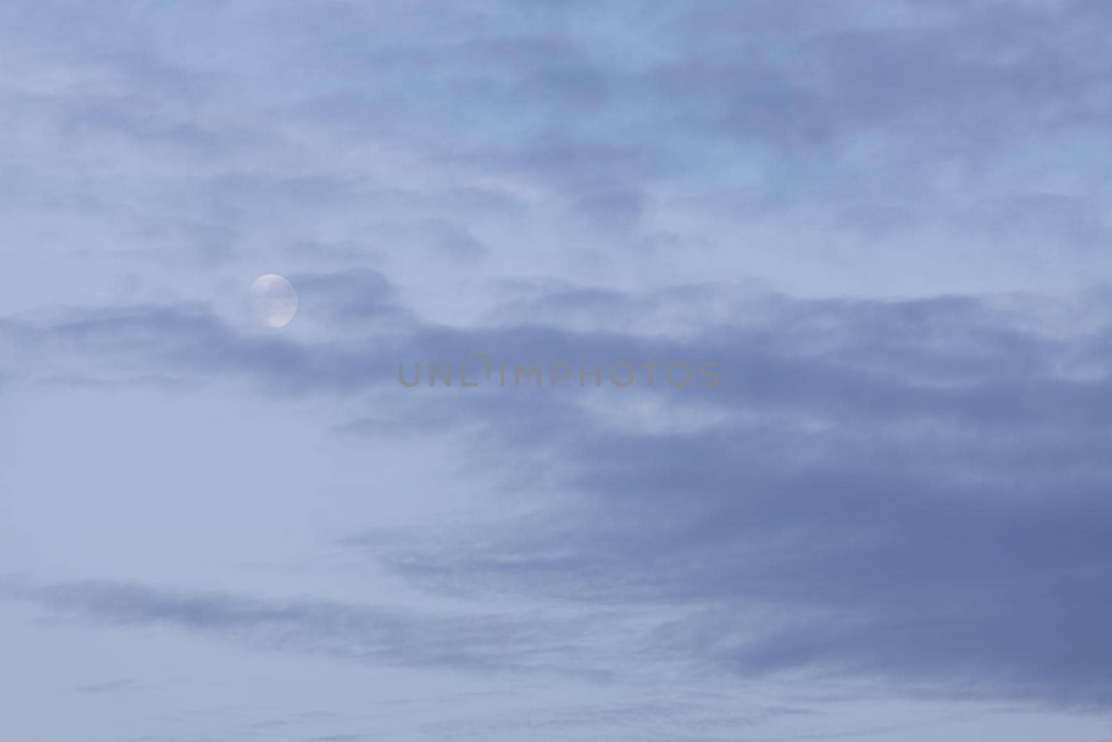 Evening sky with clouds and moon