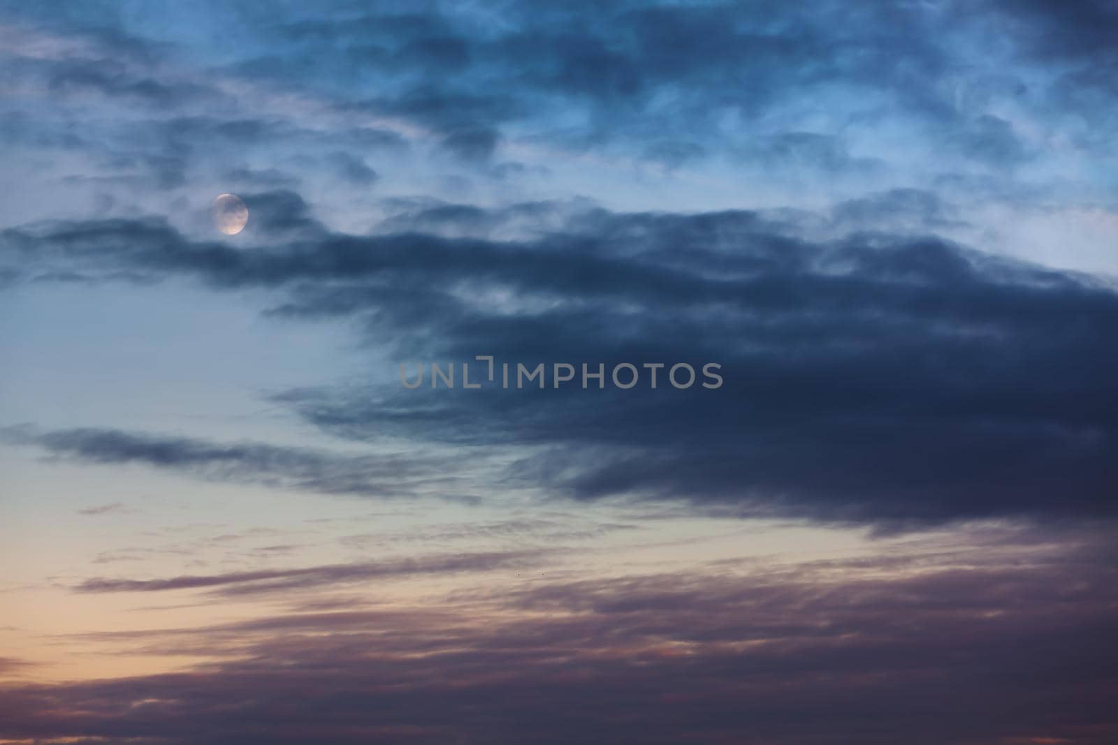 Evening sky with clouds and moon