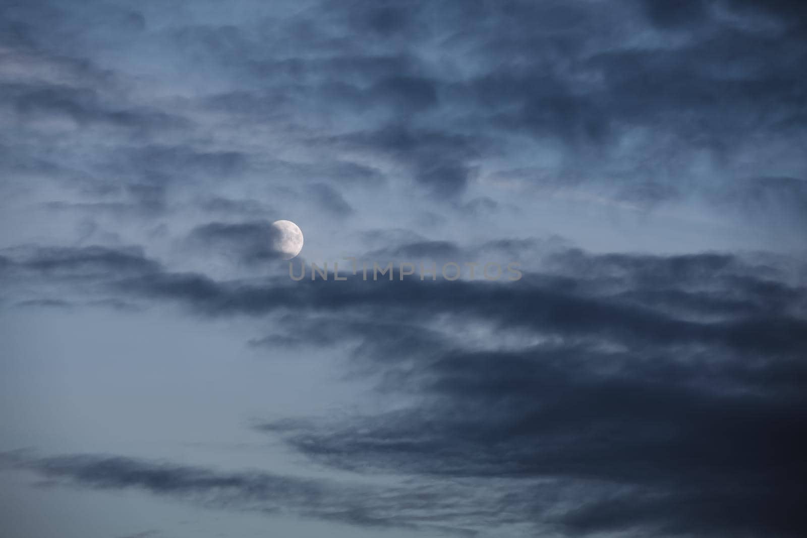 Evening sky with clouds and moon