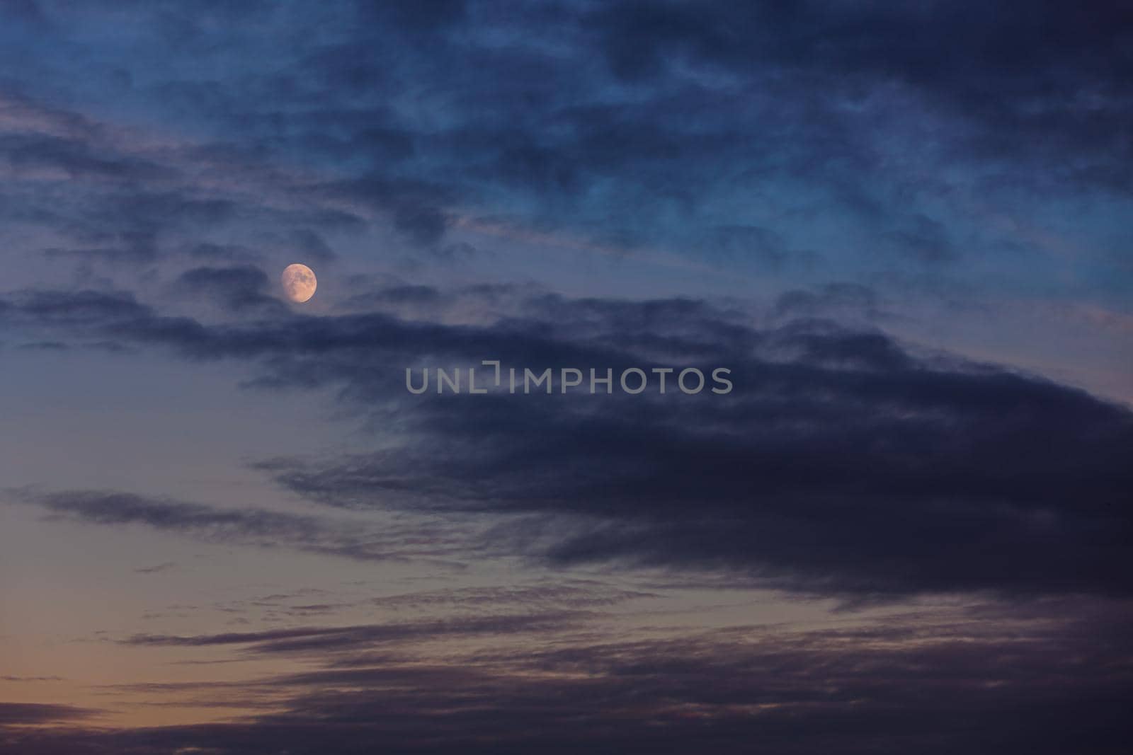 Evening sky with clouds and moon