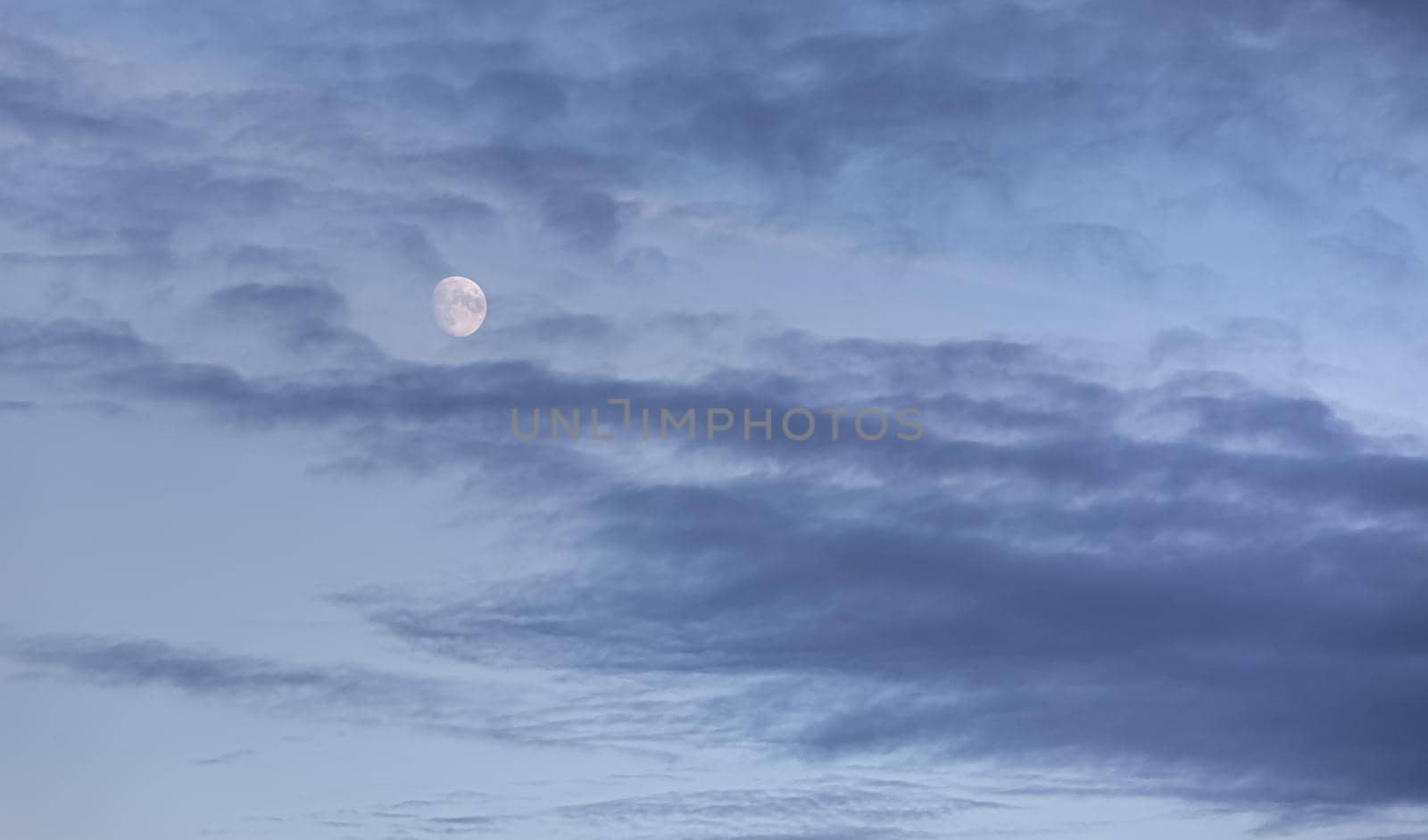 Evening sky with clouds and moon