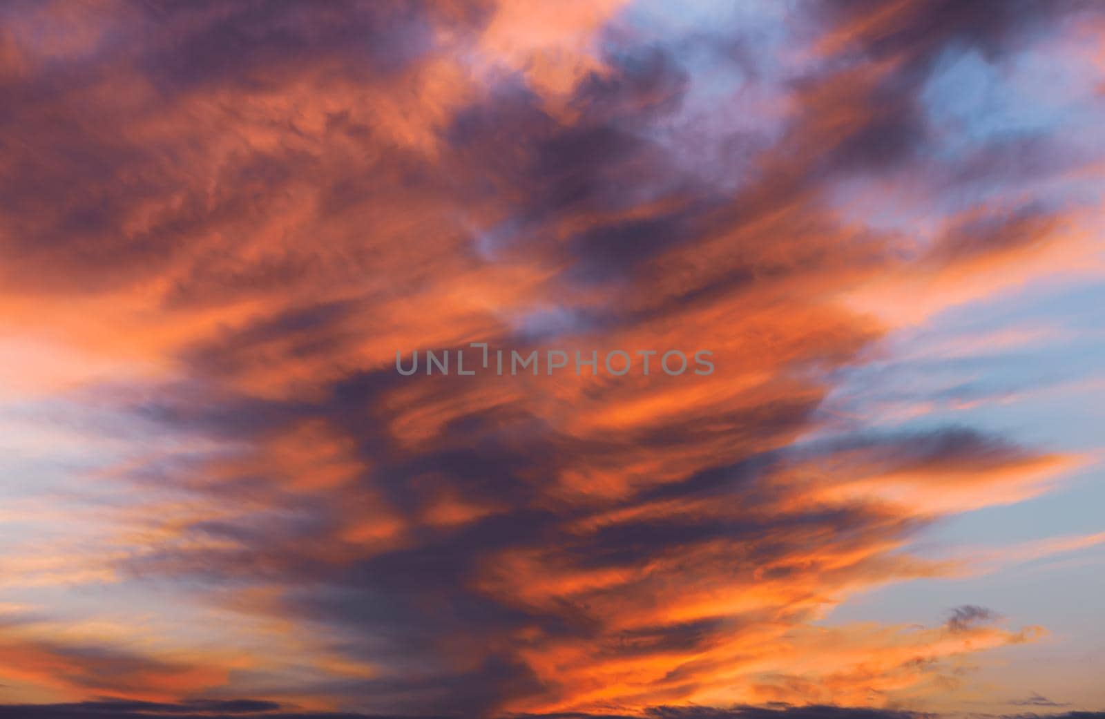Abstract nature background. Colorful dramatic sky with cloud at sunset. Dramatic and moody pink, purple and blue cloudy sunset sky