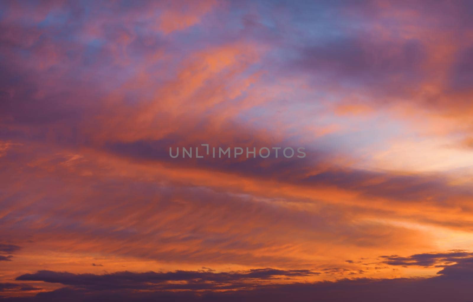 Abstract nature background. Colorful dramatic sky with cloud at sunset. Dramatic and moody pink, purple and blue cloudy sunset sky