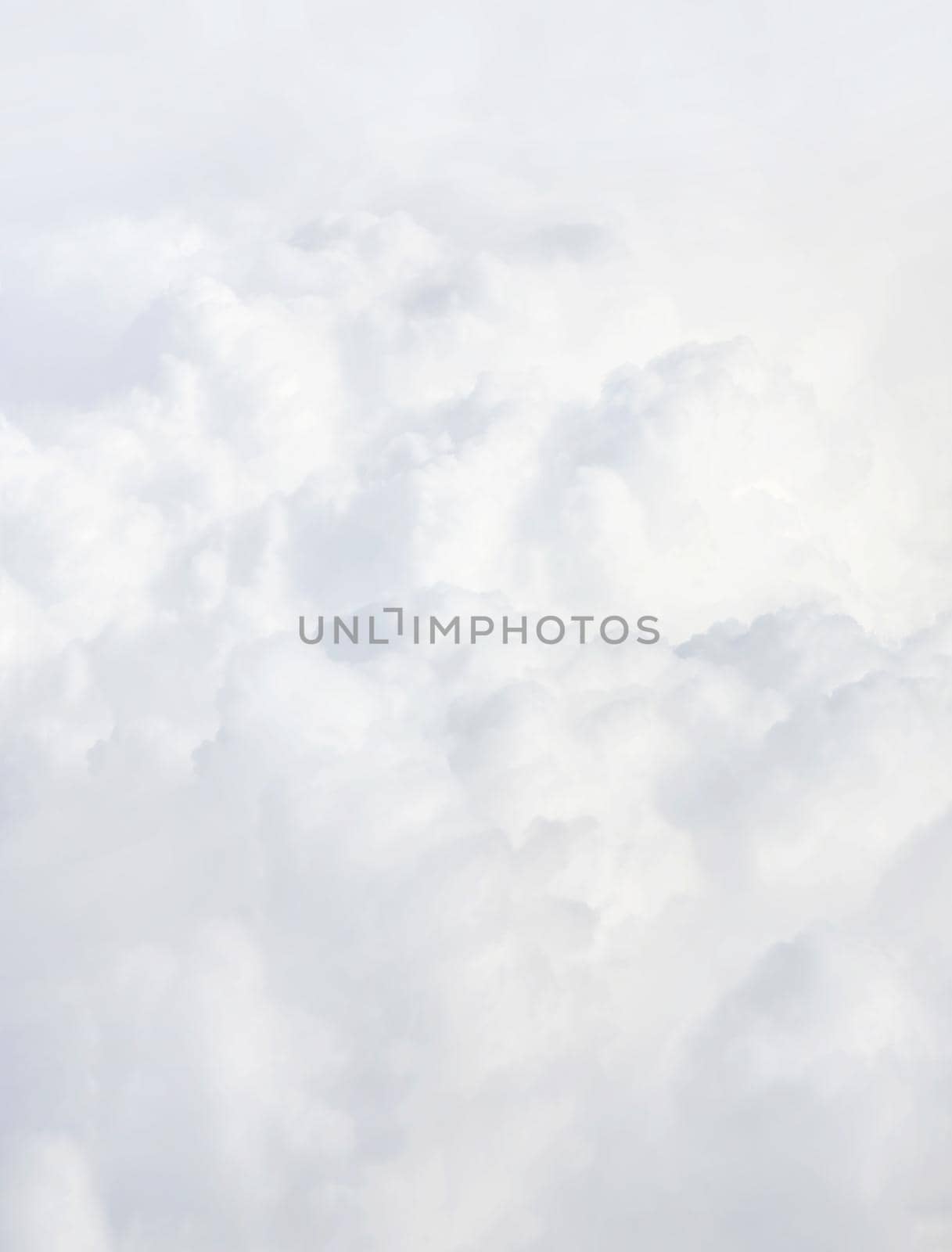 Sky with clouds, a view from an aeroplane above the clouds. Abstract nature background with clouds in light tonality. White cumulus clouds