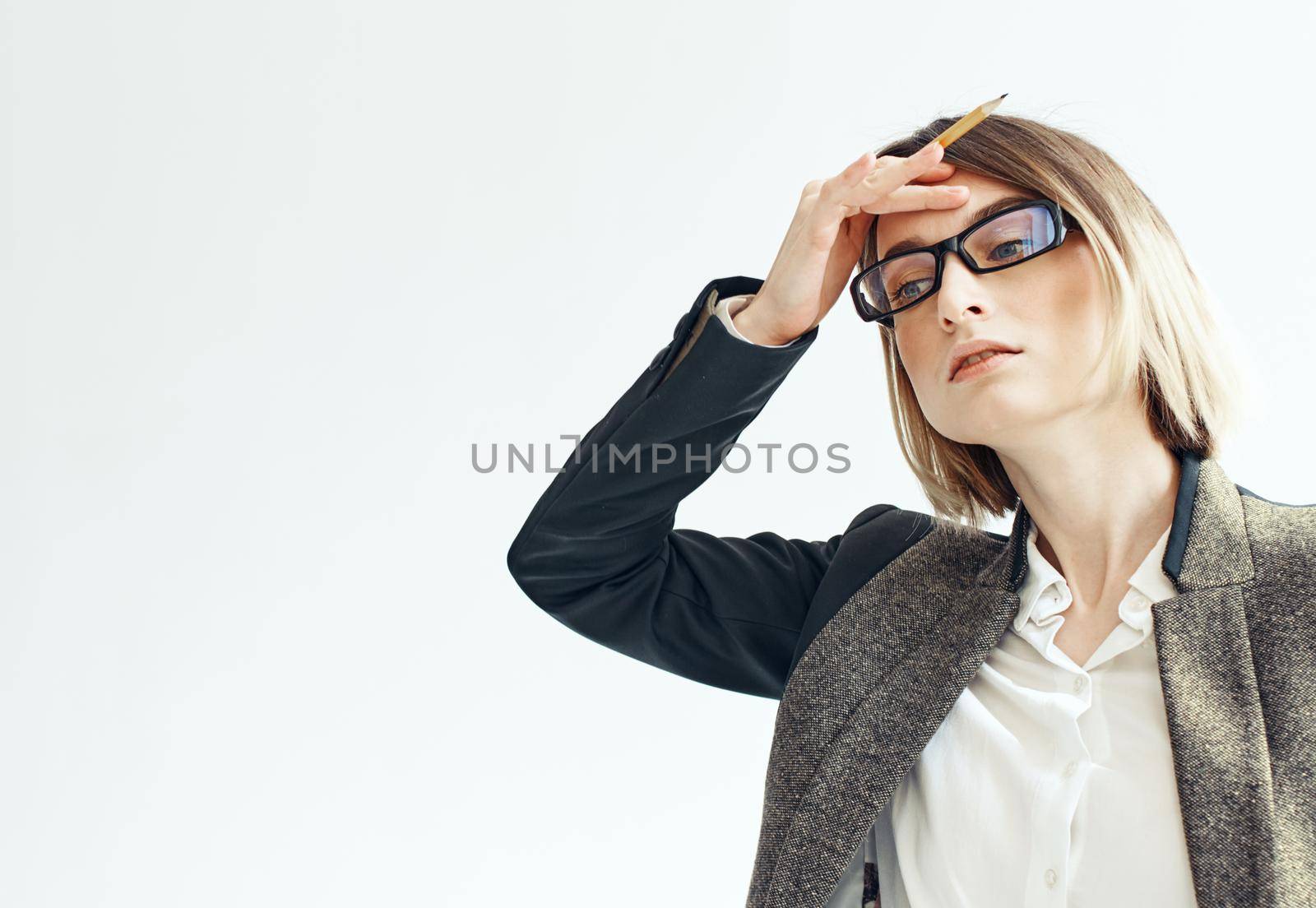 Business woman gestures with her hands on a light background suit finance by SHOTPRIME