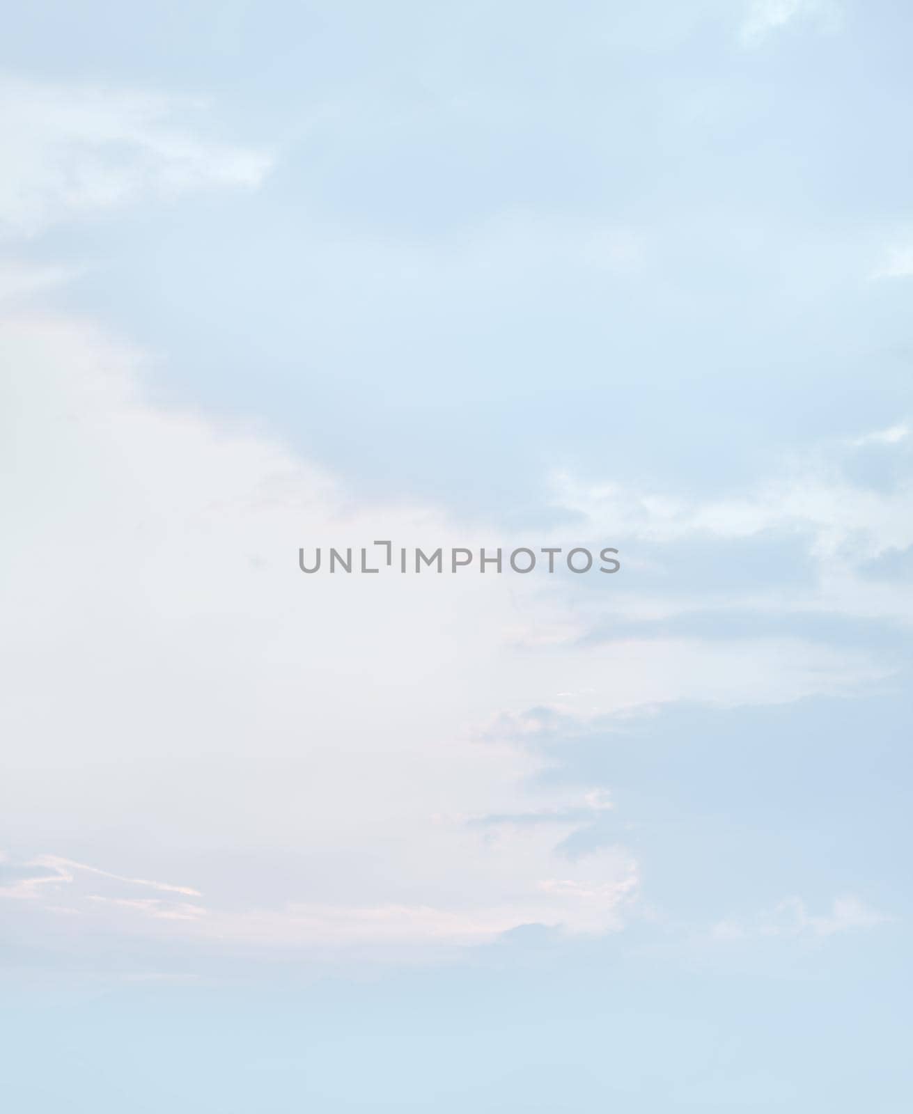 Natural sky background with clouds in light tonality. Abstract nature image for background use.