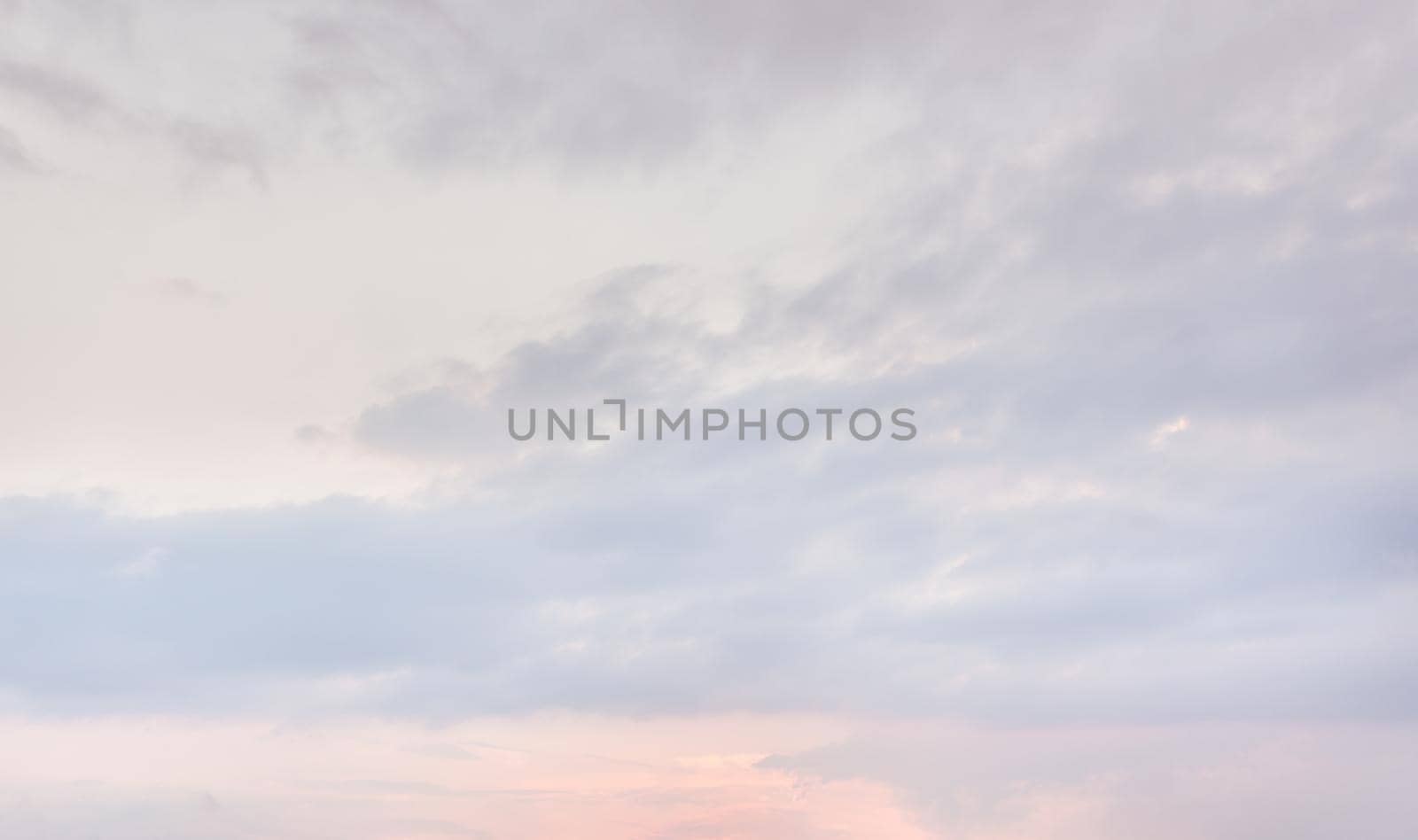 Natural sky background with clouds in light tonality. Abstract nature image for background use.
