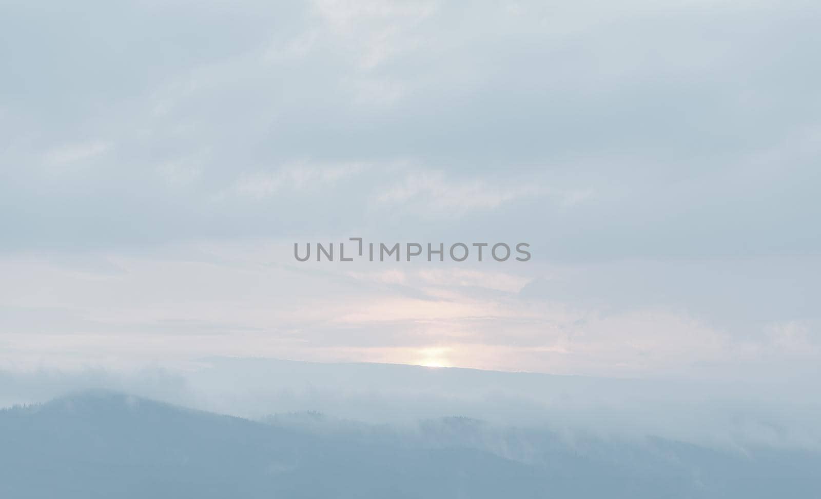 Natural sky background with clouds in light tonality. Abstract nature image for background use.
