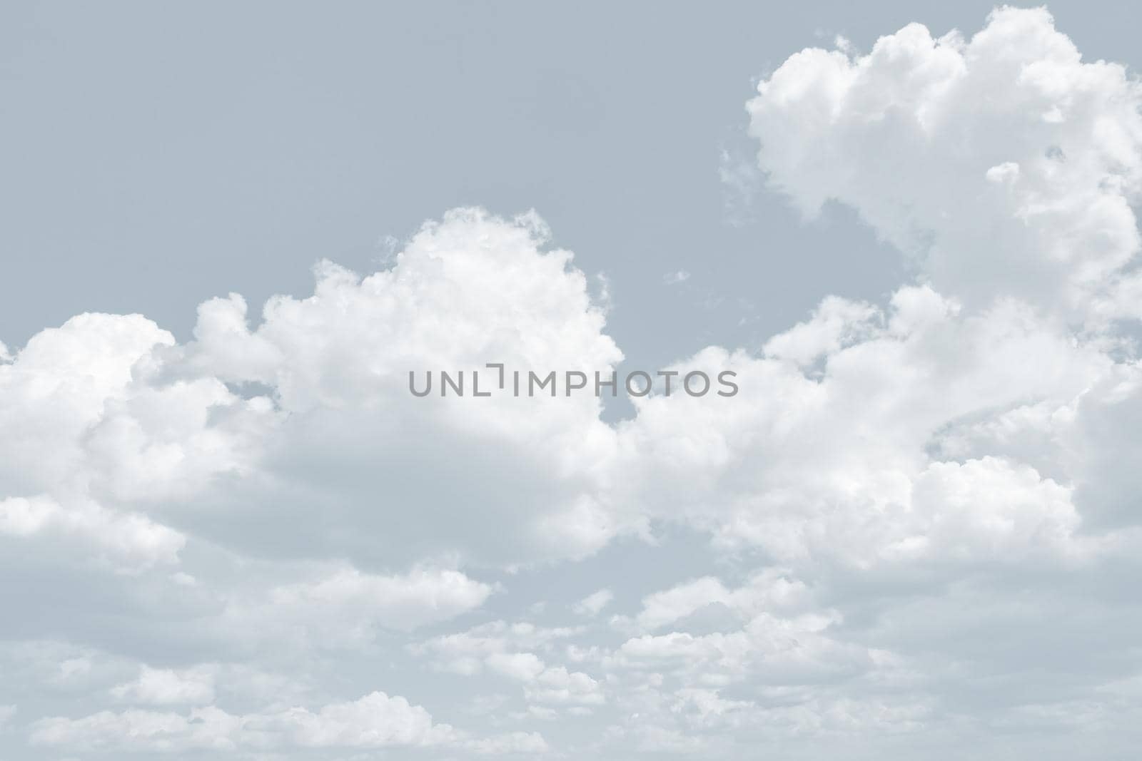 Natural sky background with clouds in light tonality. Abstract nature image for background use.