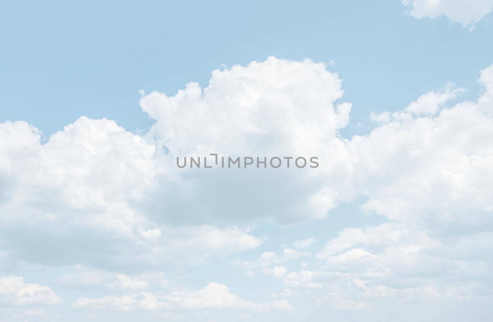 Natural sky background with clouds in light tonality. Abstract nature image for background use.