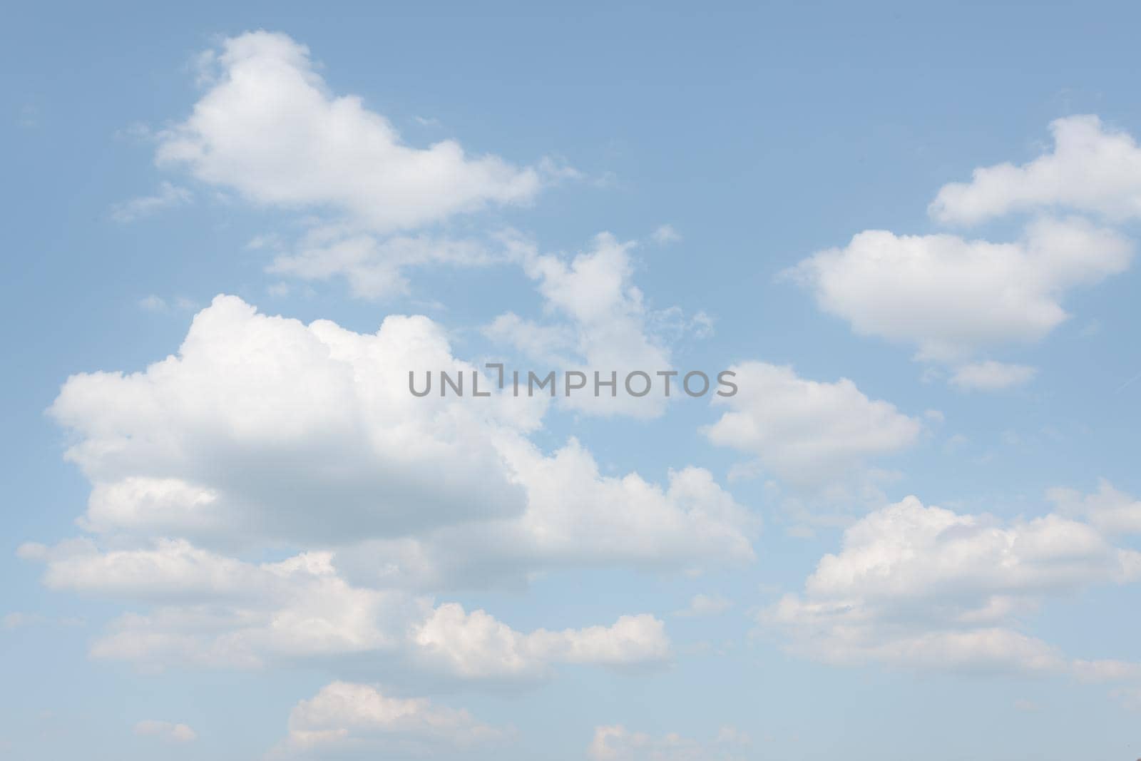 Natural sky background with clouds in light tonality. Abstract nature image for background use.