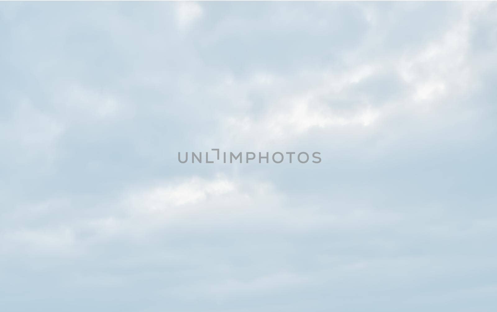 Natural sky background with clouds in light tonality. Abstract nature image for background use.