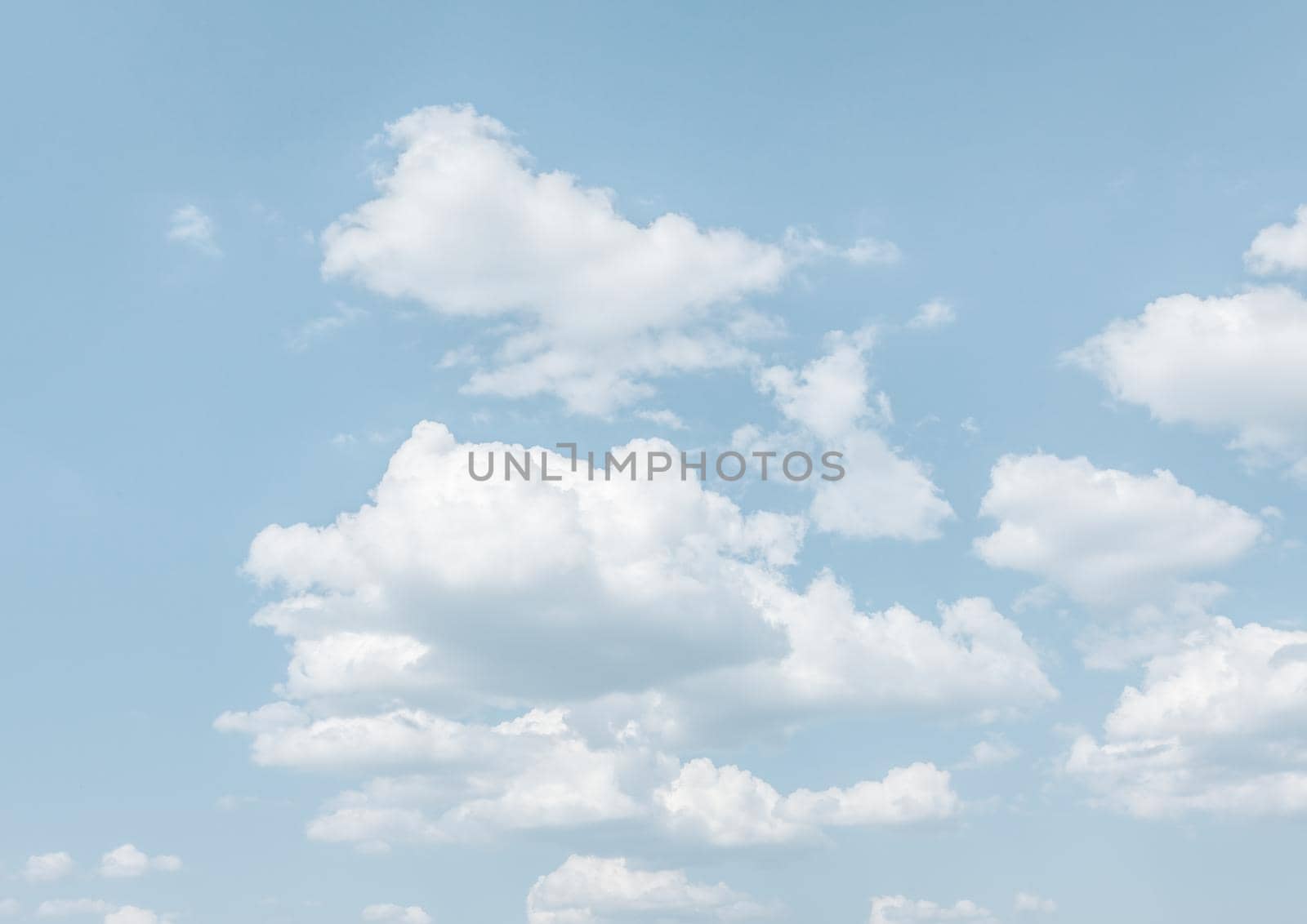 Natural sky background with clouds in light tonality. Abstract nature image for background use.