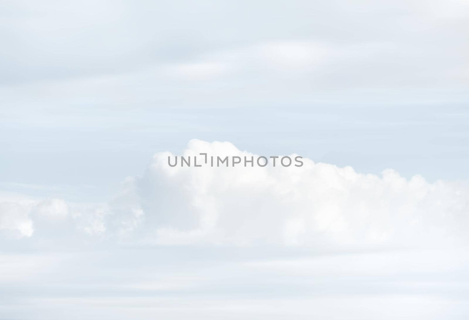 Natural sky background with clouds in light tonality. Abstract nature image for background use.