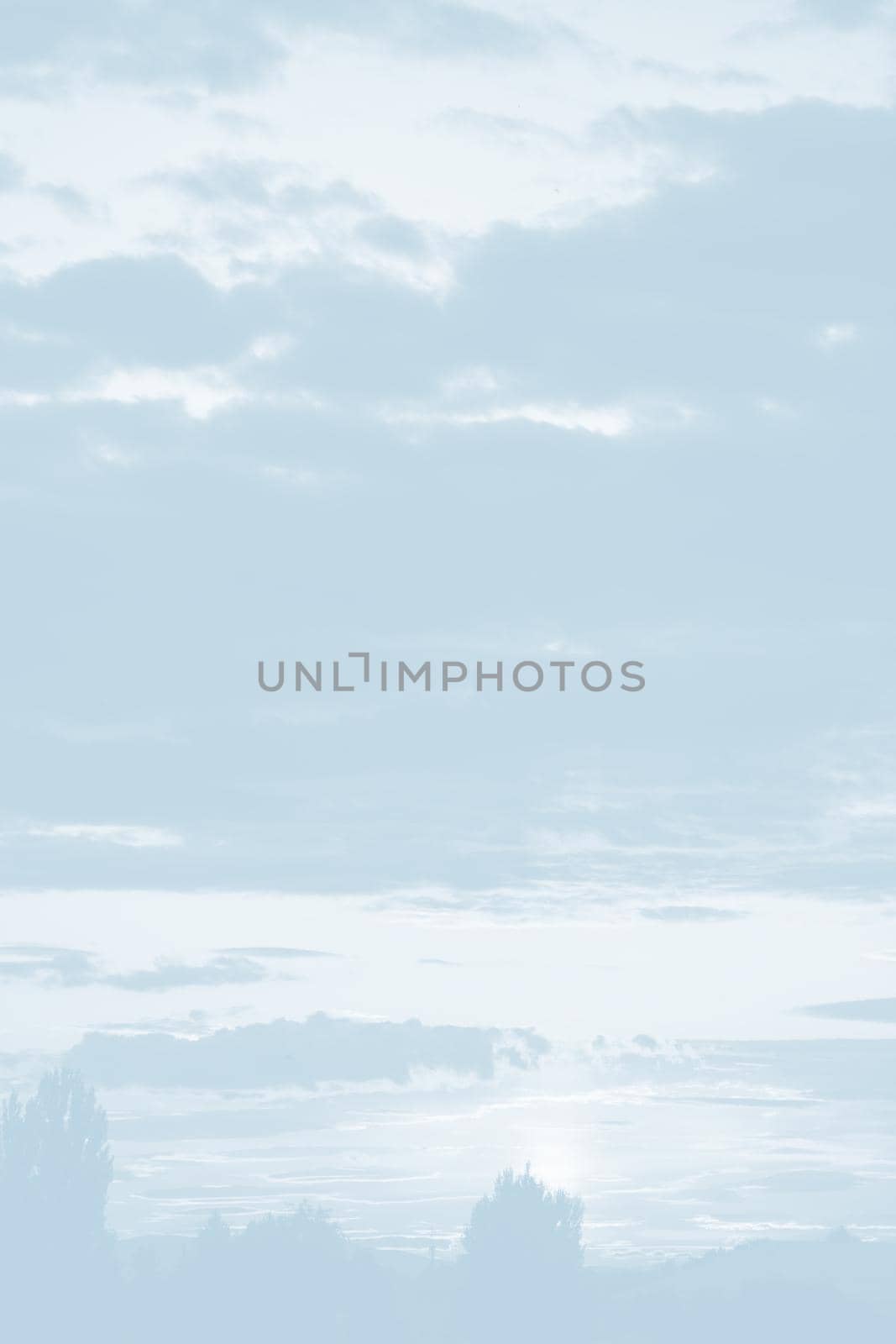 Natural sky background with clouds in light tonality. Abstract nature image for background use.