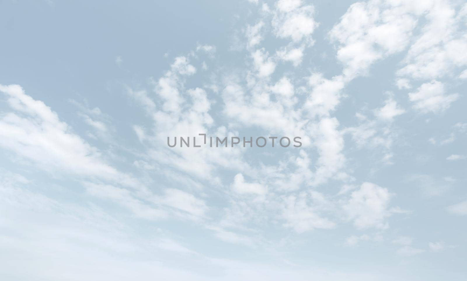 Natural sky background with clouds in light tonality. Abstract nature image for background use.