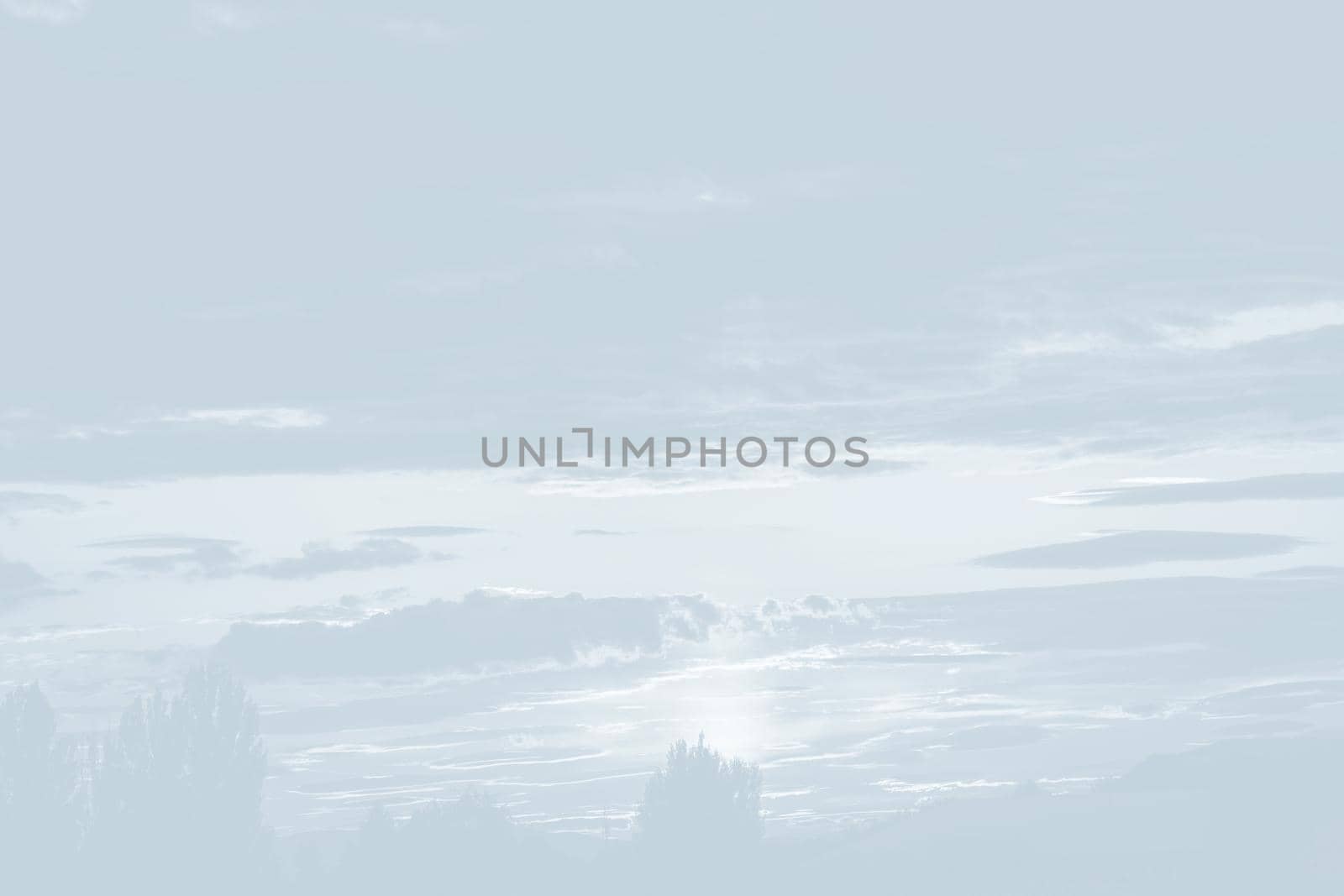 Natural sky background with clouds in light tonality. Abstract nature image for background use.