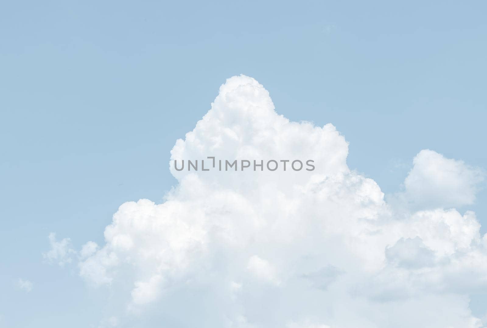 Natural sky background with clouds in light tonality. Abstract nature image for background use.