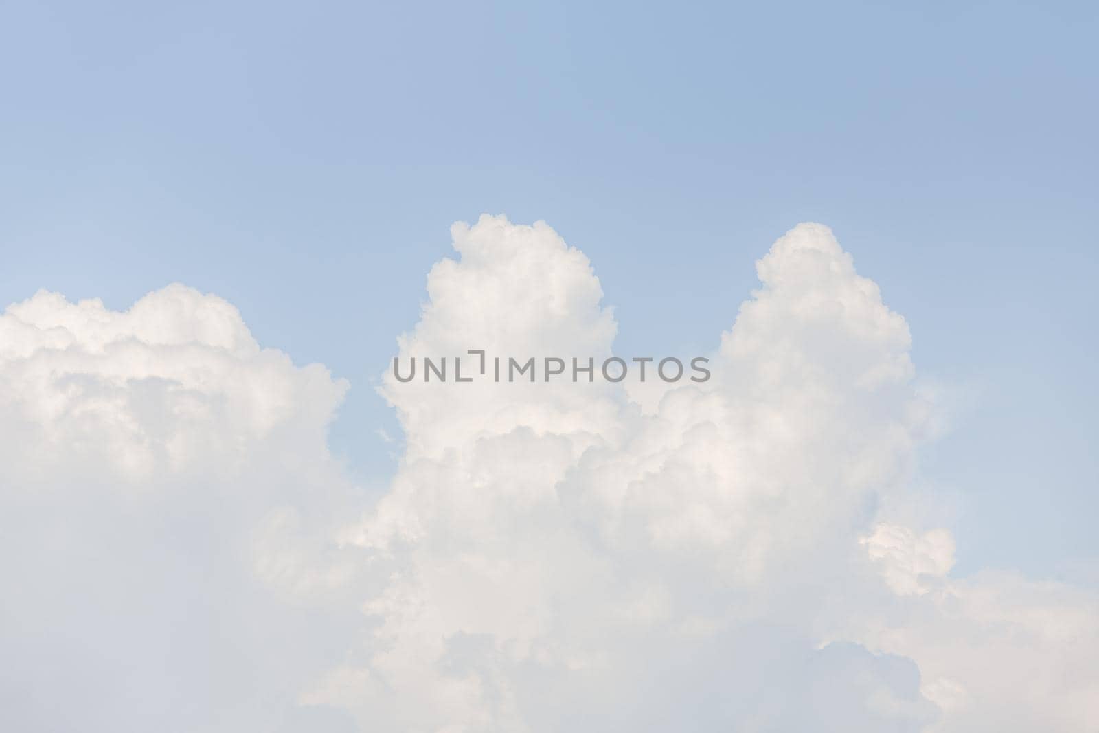 Natural sky background with clouds in light tonality. Abstract nature image for background use.