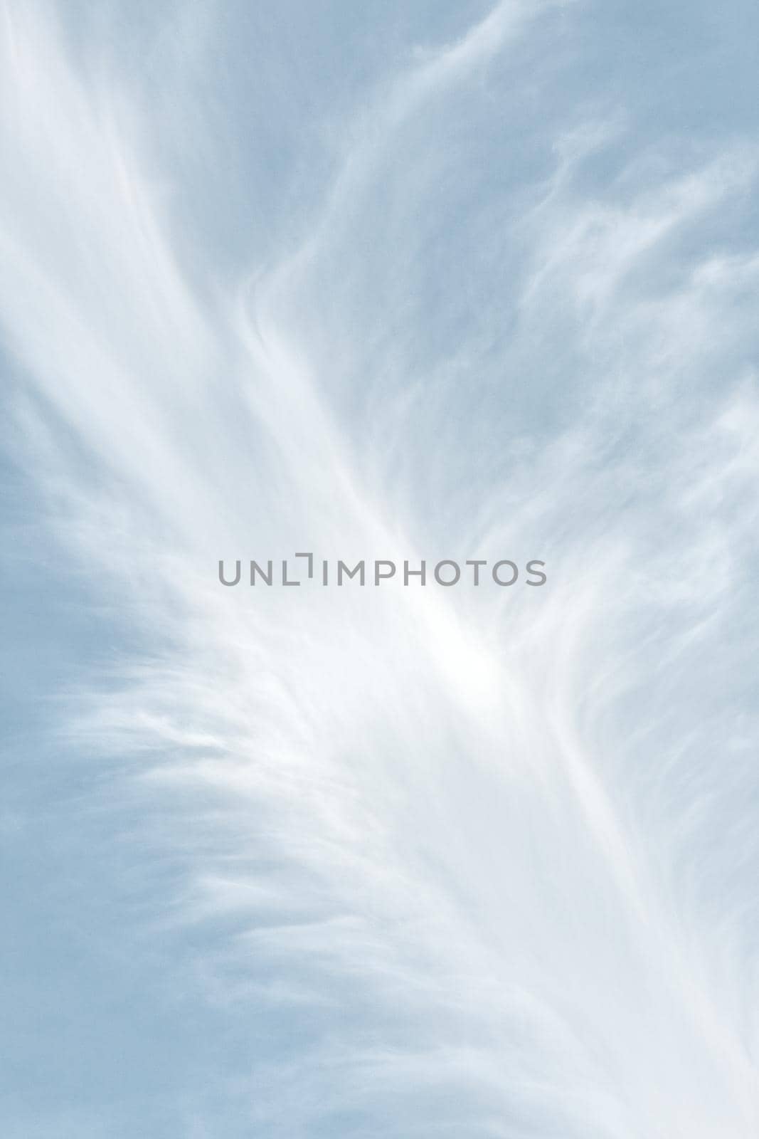 Natural sky background with clouds in light tonality. Abstract nature image for background use.