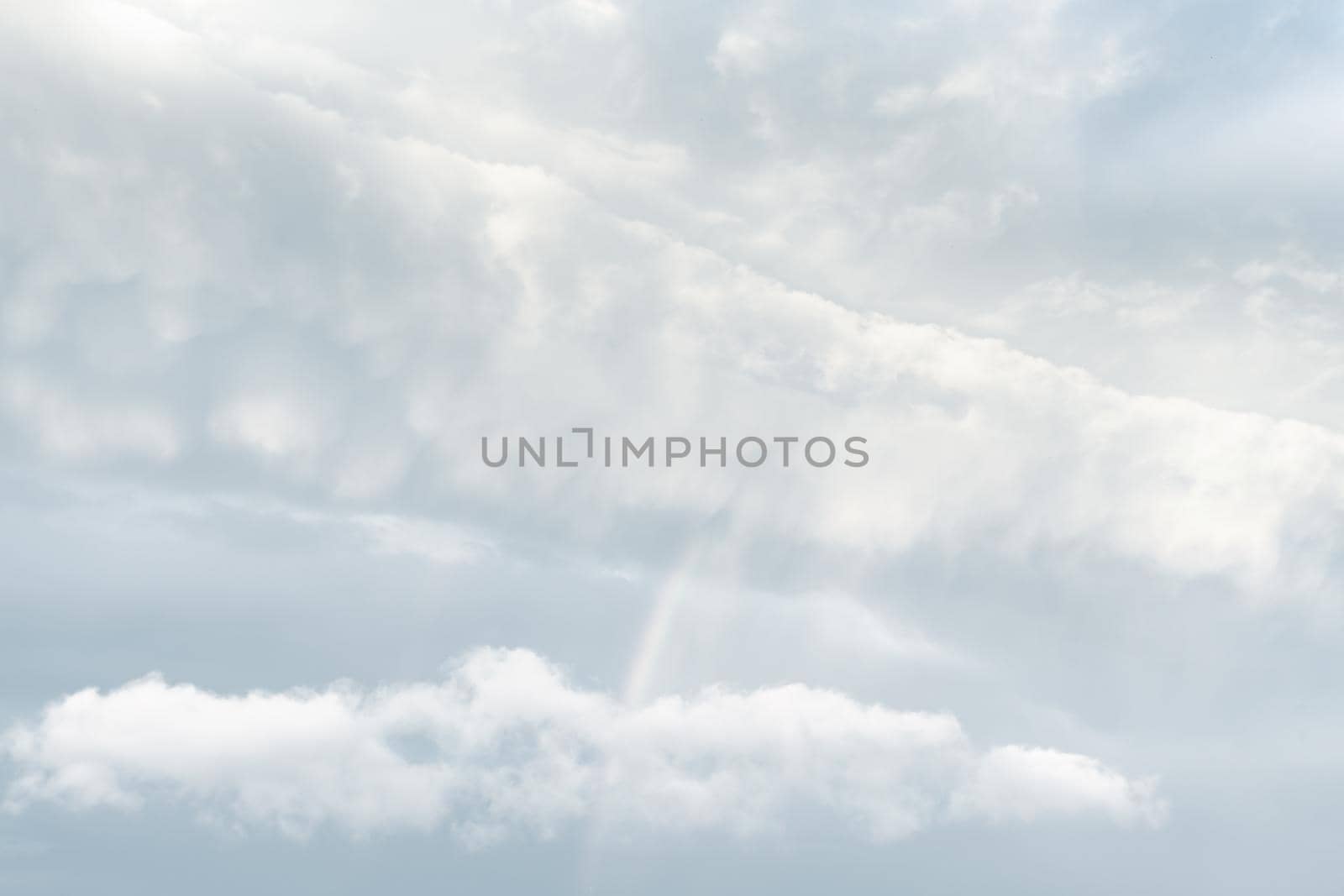 Natural sky background with clouds in light tonality. Abstract nature image for background use.