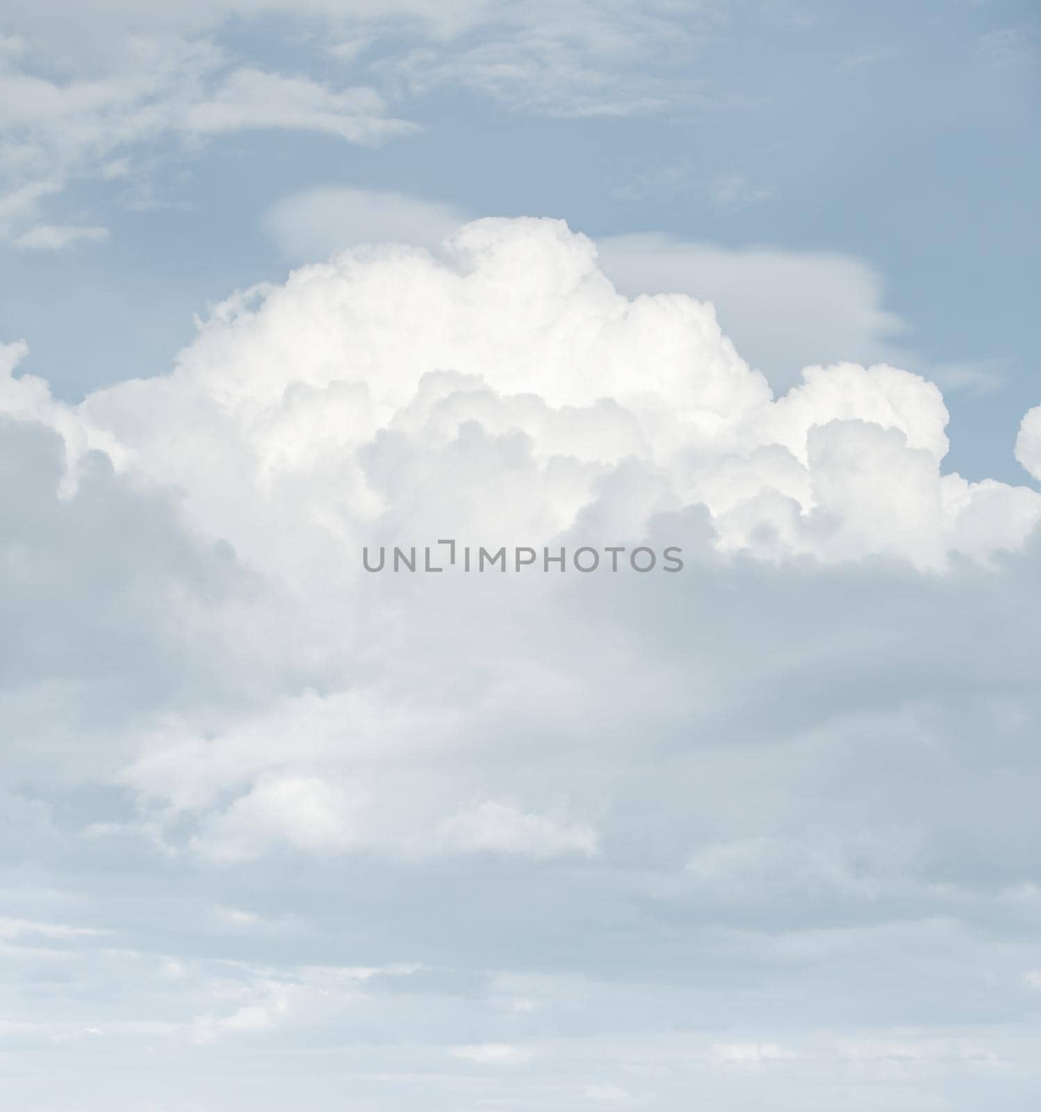 Natural sky background with clouds in light tonality. Abstract nature image for background use.