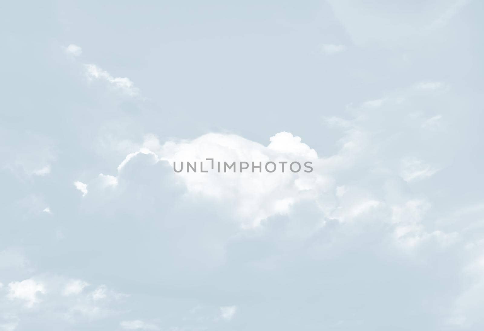 Natural sky background with clouds in light tonality. Abstract nature image for background use.