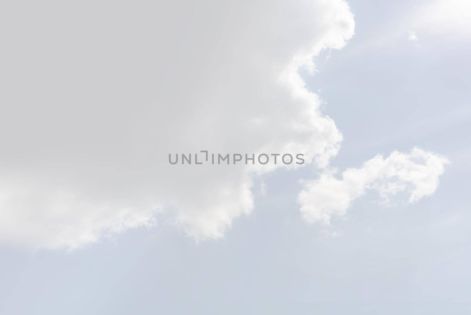 Natural sky background with clouds in light tonality. Abstract nature image for background use.